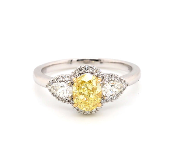 Fancy Light Oval Cut Yellow Diamond Engagement Ring