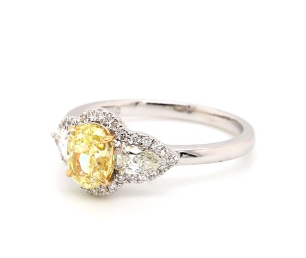 Fancy Light Oval Cut Yellow Diamond Engagement Ring